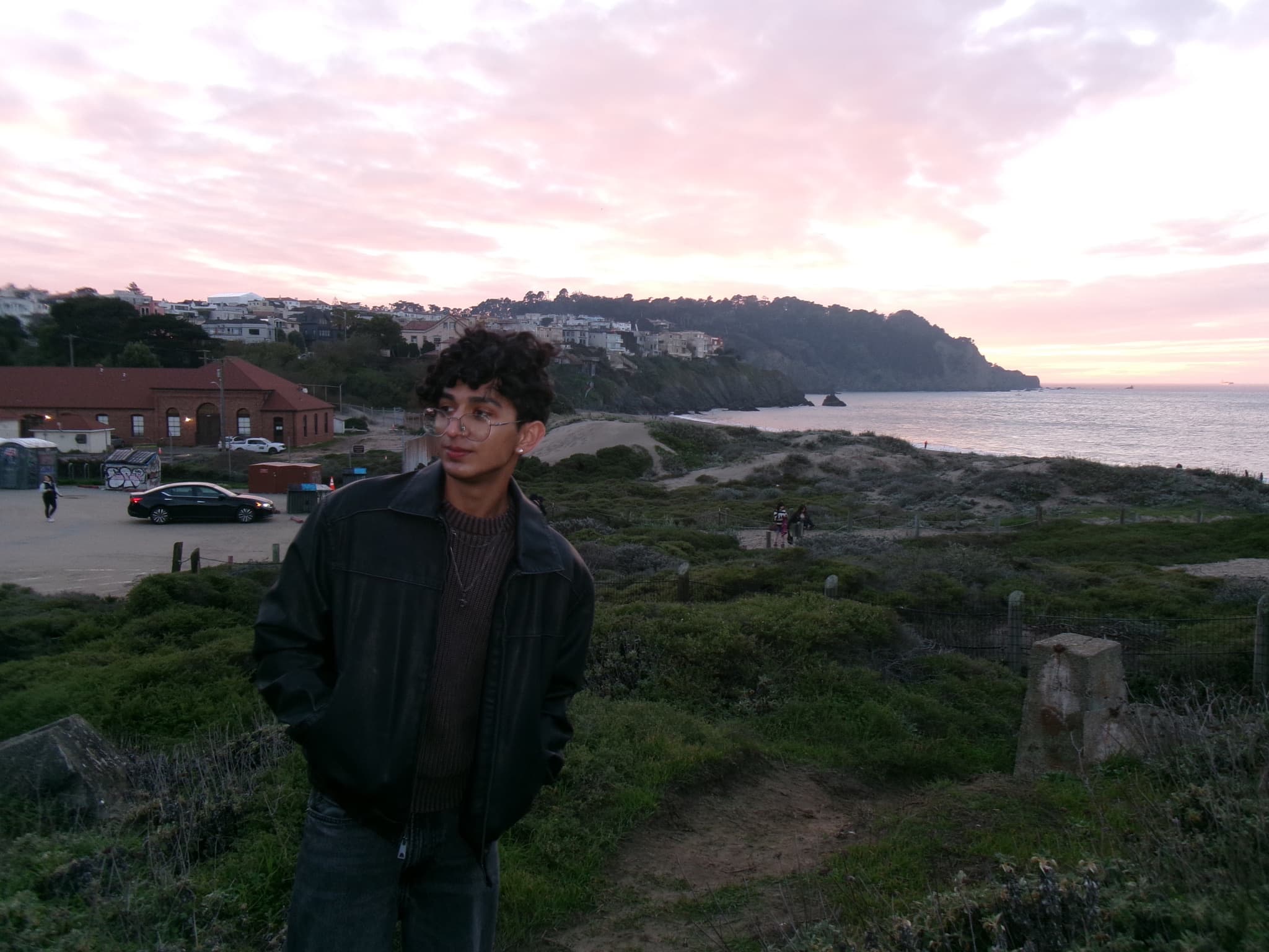Dhruva at a coastal overlook at sunset